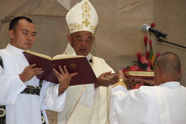 bishop presenting gospels.jpg